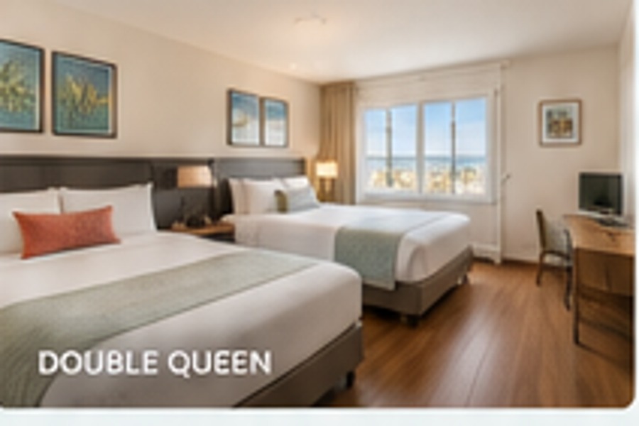 Double queen guest room with modern bedding